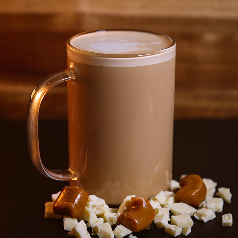 Image of Ellianos Coffee's Quality Hand-Crafted Caffe Dolce Signature Drink. Enjoy the luxurious life with this treat. Decadent white chocolate mingles with creamy caramel, smooth espresso, and creamy milk.