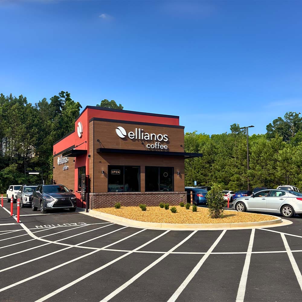 Store front of Ellianos Cartersville location with cars in line